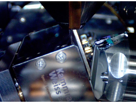 Measurement setup in the GeminiSEM 450 field emission electron microscope showing the heating stage tilted 70° towards the Symmetry S2 EBSD camera. Top: ambient conditions. Bottom: ~850°C showing significant IR radiation.